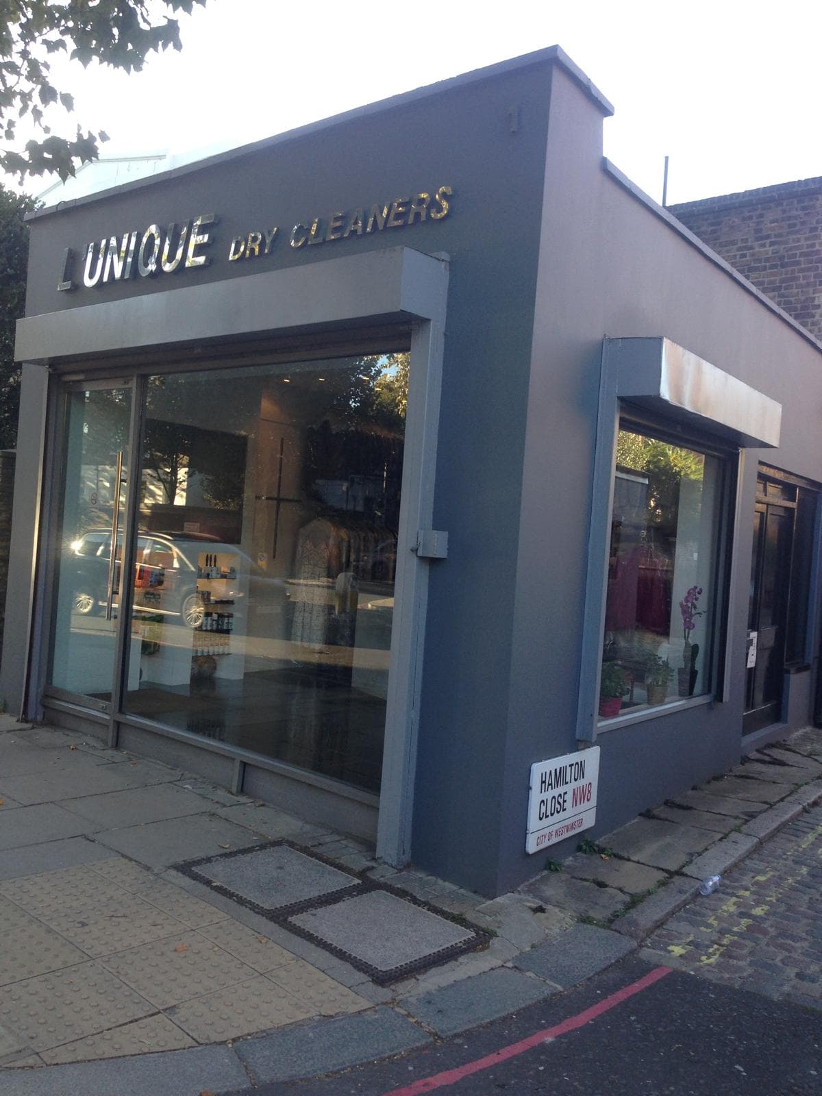 L'Unique Expert Dry Cleaners shopfront on Hamilton Close, St John's Wood NW8